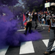 A smoke bomb is thrown at a group of counter-protesters during a clash against members of white nationalist protesters in Charlottesville.